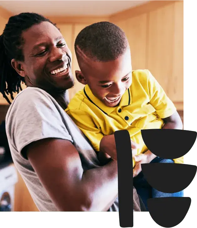 A Father and son playing together in the house